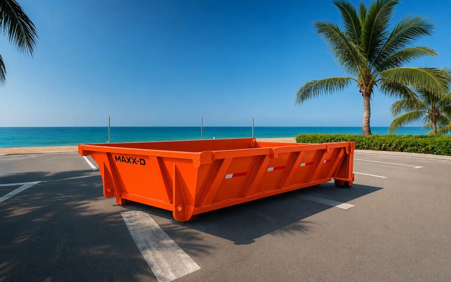 Orange low boy dumpster for heavy debris